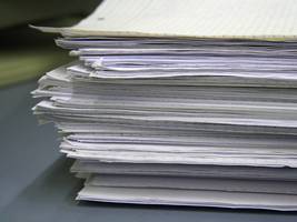 A pile of papers on the table